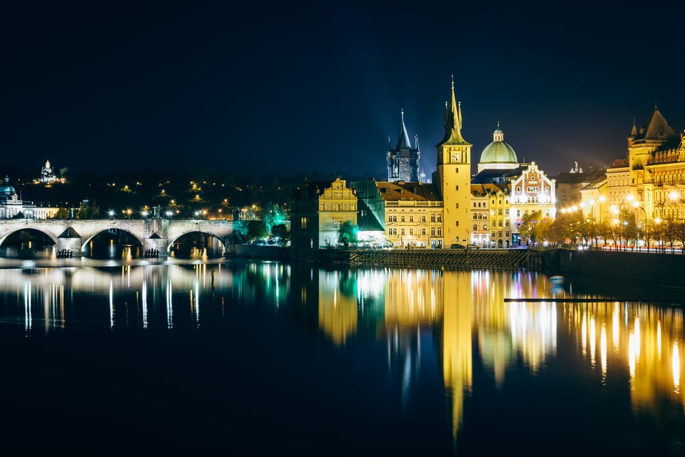 Charles Bridge and buildings along the Vltava at night, in Prague, Czech Republic.-1