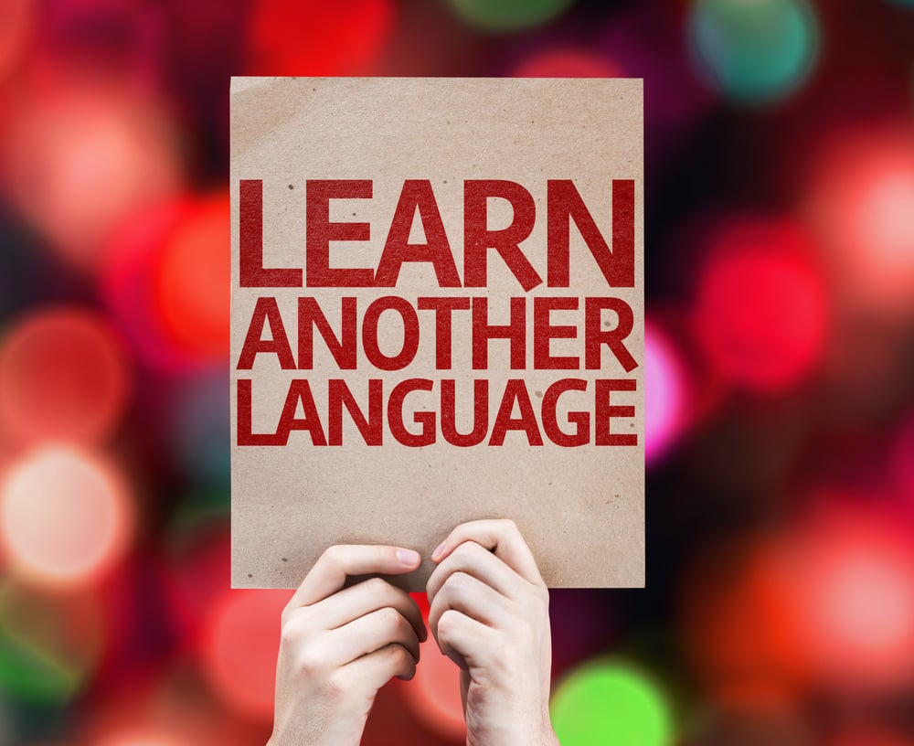 Learn Another Language card with colorful background with defocused lights-1