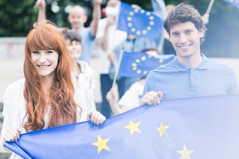 Picture of young community workers with european union flags-1