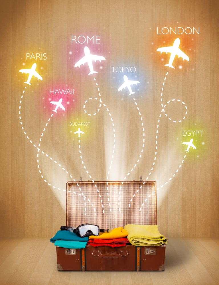 Travel bag with clothes and colorful planes flying out on grungy background
