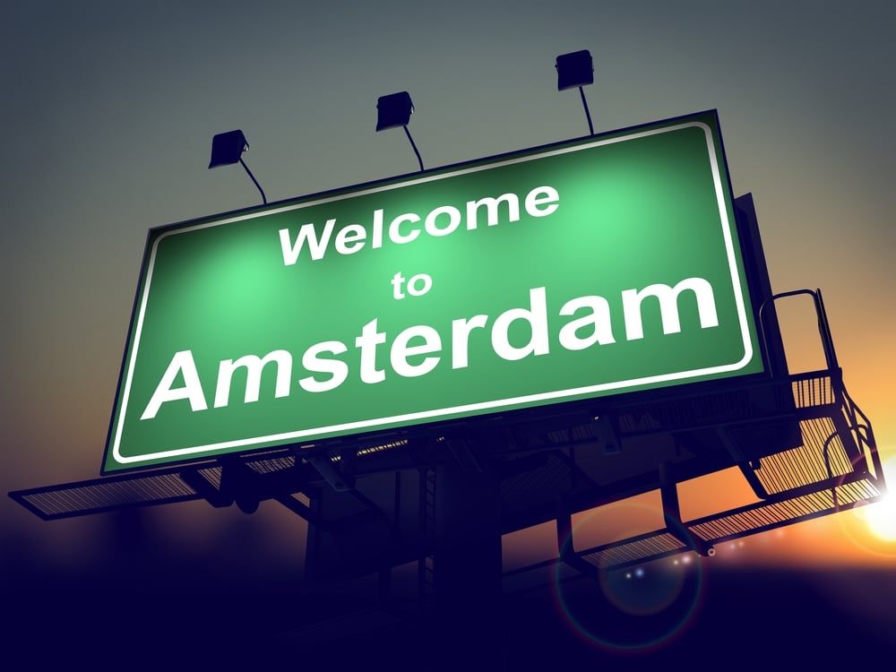 Welcome to Amsterdam - Green Billboard on the Rising Sun Background.-2