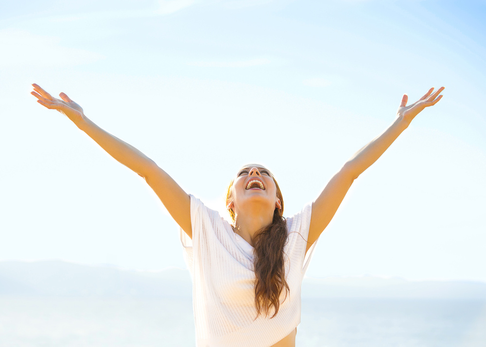 Woman smiling arms raised up to blue sky, celebrating freedom. Positive human emotions, face expression feeling life perception success, peace of mind concept. Free Happy girl on beach enjoying nature-2