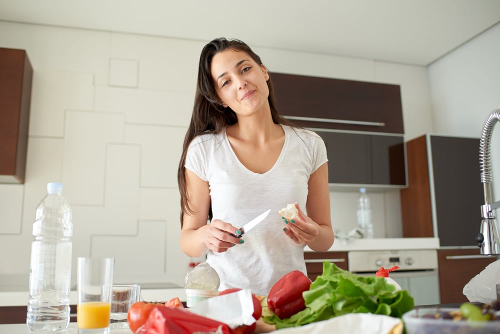 Young Woman Cooking in the kitchen. Healthy Food - Vegetable Salad. Diet. Dieting Concept. Healthy Lifestyle. Cooking At Home. Prepare Food-2
